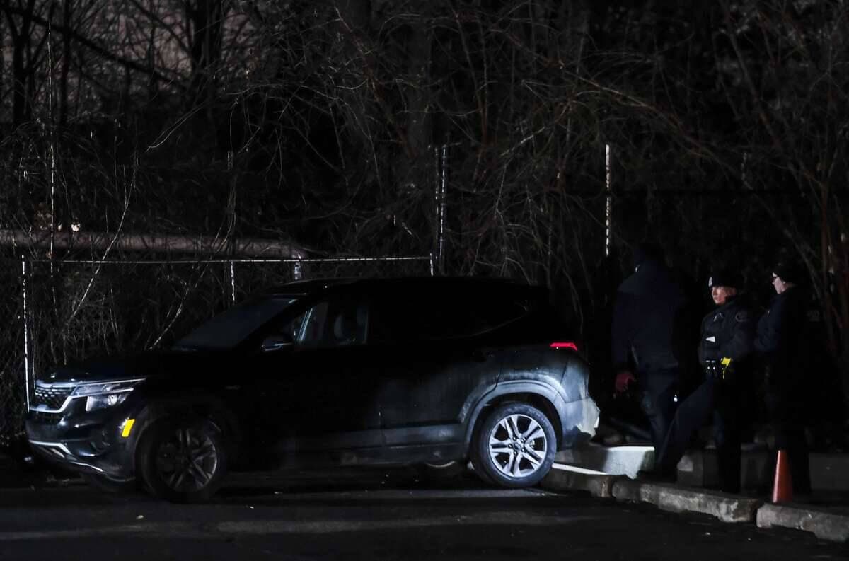 DETROIT, MI - DECEMBER 04: Law enforcement officers inspect the vehicle belonging to James and Jennifer Crumbley, the parents of suspected Oxford High School shooter Ethan Crumbley, following their arrest on December 4, 2021 in Detroit, Michigan. James and Jennifer Crumbley were wanted by law enforcement after failing to appear for their arraignment following charges for their connection to the shooting in Oxford, Michigan on Tuesday. Matthew Hatcher/Getty Images/AFP == FOR NEWSPAPERS, INTERNET, TELCOS & TELEVISION USE ONLY ==